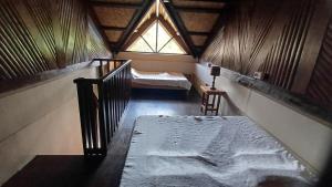 Postel nebo postele na pokoji v ubytování Le Cou de Tou Village Resort