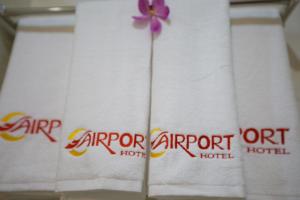 a purple flower on top of a towel at The Airport Hotel in Ho Chi Minh City +26 photos