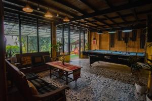a large living room with a pool table in it at Sapa Ta Van Desi House - Mountain View & Hiking Tours in Sapa