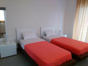 Postel nebo postele na pokoji v ubytování Fevronia's Rooms