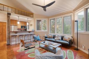 a living room with a couch and a table at Manitou River House 113 by AvantStay A Location in Telluride