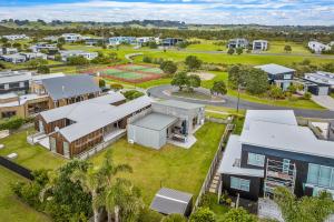 an aerial view of a house in a suburb at The Weekender - Omaha Holiday Home in Warkworth