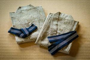 two ties sitting on top of a table at THE MACHIYA KAZAHAYA in Kyoto
