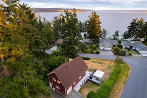 an aerial view of a house with a garage at Polnell Point Lookout by AvantStay Water Views Hot Tub Large Patio in Oak Harbor