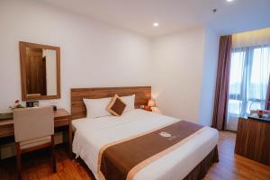 Postel nebo postele na pokoji v ubytování Hotel A89 Rosarian