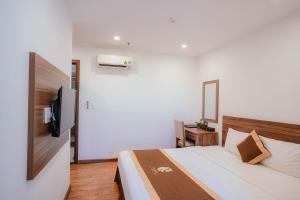 Postel nebo postele na pokoji v ubytování Hotel A89 Rosarian