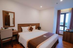 Postel nebo postele na pokoji v ubytování Hotel A89 Rosarian