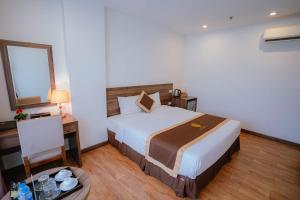 Postel nebo postele na pokoji v ubytování Hotel A89 Rosarian