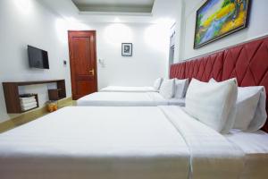 Postel nebo postele na pokoji v ubytování Hanoi Shining House