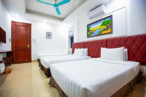 Postel nebo postele na pokoji v ubytování Hanoi Shining House