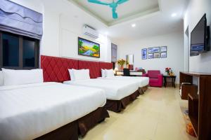 Postel nebo postele na pokoji v ubytování Hanoi Shining House