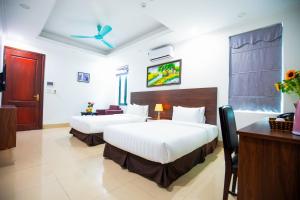 Postel nebo postele na pokoji v ubytování Hanoi Shining House
