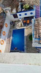 an overhead view of a building with a blue door at Divine Beach Resorts in Pondicherry