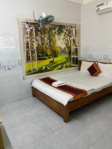 Postel nebo postele na pokoji v ubytování Khách Sạn Nguyên Trung