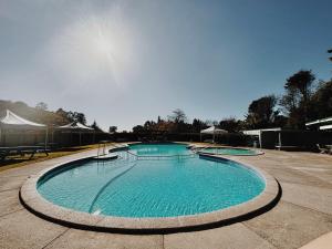 Bazén v ubytování Welcome Bay Hot Pools nebo v jeho okolí