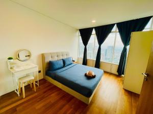 a bedroom with a bed with a teddy bear on it at Vortex suites klcc by Yashrib in Kuala Lumpur