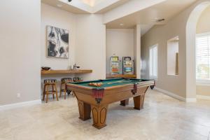 a living room with a pool table in it at Camila by AvantStay 18-Person Temecula Mansion in Temecula
