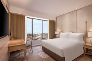 Dusit Princess Melaka客房内的一张或多张床位