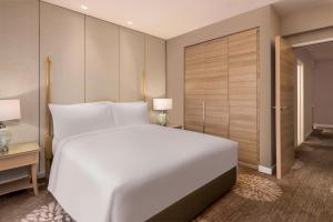 Dusit Princess Melaka客房内的一张或多张床位