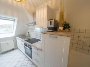 Kuhinja oz. manjša kuhinja v nastanitvi CASARiNA - Über den Dächern Leipzigs + 8 fotografij