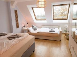 Postelja oz. postelje v sobi nastanitve CASARiNA - Über den Dächern Leipzigs