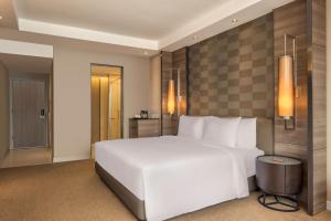 Dusit Princess Melaka客房内的一张或多张床位