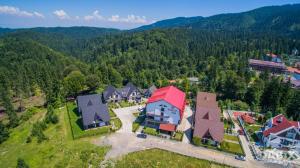 an aerial view of a house with a red roof at Princess Butique in Poiana Brasov