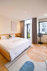 Postel nebo postele na pokoji v ubytování Hue House Stay Gần Aeon Mall Huế