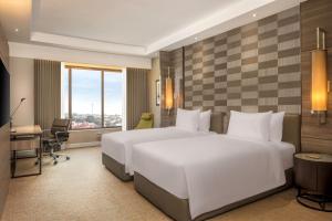 Dusit Princess Melaka客房内的一张或多张床位