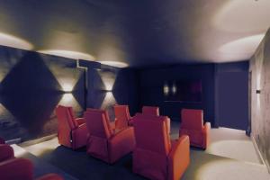 a group of chairs in a waiting room at Club House 305 w PRIVATE NIGHTCLUB, Cinema, Game Room, Gym & Pool in Miami