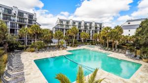 an image of a swimming pool at a resort at 314 C Shipwatch by AvantStay Gorgeous Condo in Great Community in Isle of Palms