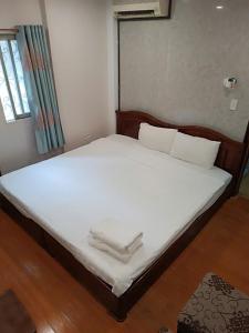 Voodi või voodid majutusasutuse Hanoi Carina Hotel toas