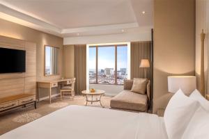 Dusit Princess Melaka客房内的一张或多张床位
