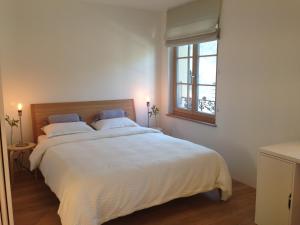 Postel nebo postele na pokoji v ubytování Carouge Loft Apartment