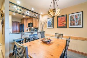 a kitchen and dining room with a wooden table and chairs at Etta Place Too 103 by AvantStay Close to Town The Slopes In Complex w Communal Pool Hot Tub in Telluride