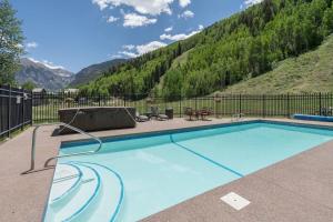 a swimming pool with a view of a mountain at Etta Place Too 103 by AvantStay Close to Town The Slopes In Complex w Communal Pool Hot Tub in Telluride
