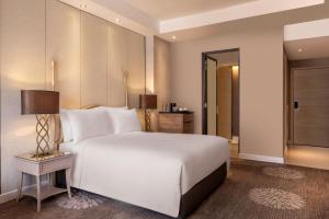 Dusit Princess Melaka客房内的一张或多张床位