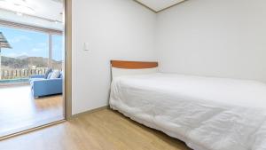 Postel nebo postele na pokoji v ubytování Gapyeong Mois