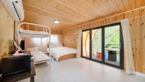 Ένα ή περισσότερα κρεβάτια σε δωμάτιο στο Gapyeong Soopia pension