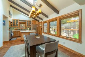 a kitchen with a dining room table and chairs at Henderson by AvantStay Lake View Walk to Beach Garwoods More in Carnelian Bay