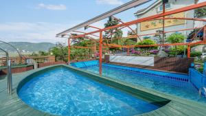 a pool on the side of a building with a house at Gangwha Jeongwon Pension in Incheon