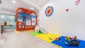 a childs room with a toy truck and a playground at Gapyeong Paradiso Kids Poolvilla in Gapyeong +7 photos