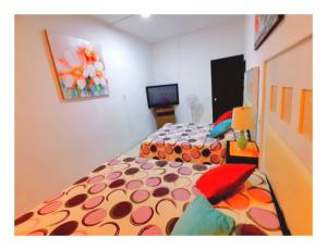 Postel nebo postele na pokoji v ubytování SUITE LA CONQUISTA PARA 4 PERSONAS EN CAMA Y 3 PERSONAS EN SOFÁ CAMA 7 en total