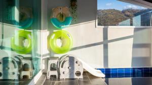 a bathroom with a sink and toilets in a room at Gyeongju Modern Pool Villa in Gyeongju +2 photos