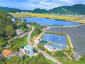 an aerial view of a town and a lake at Ganghwa Dondaemoru pension in Incheon