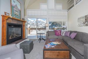 a living room with a couch and a fireplace at Etta Place Too 113 by AvantStay Close to Town The Slopes In Complex w Communal Pool Hot Tub in Telluride