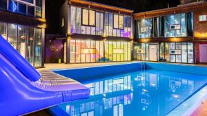 a pool with a slide in front of a building at Gapyeong Daengdaengi Dog Pension Silver in Gapyeong +18 photos