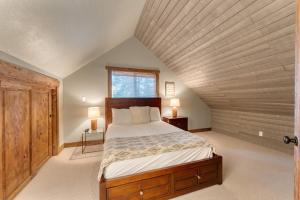 a bedroom with a large bed in a attic at Washoe Way by AvantStay Luxury Tahoe Retreat A Location w Beach Access in Tahoe City