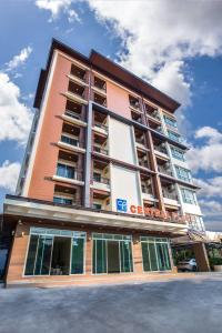 a tall building with a sign on the side of it at Central Place Serviced Apartment Angsila in Ang Sila