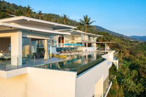 an aerial view of a house with a swimming pool at Villa ME Huge and Luxurious villa in Ban Thong Phlu